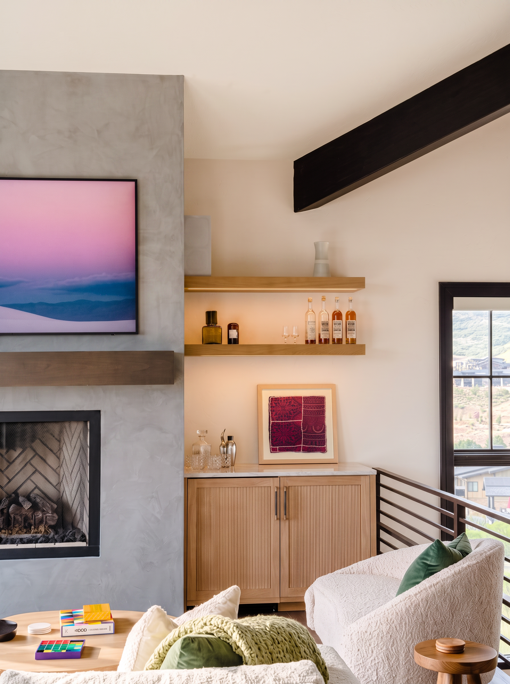 Built-in bar with oak shelving beside the great room fireplace