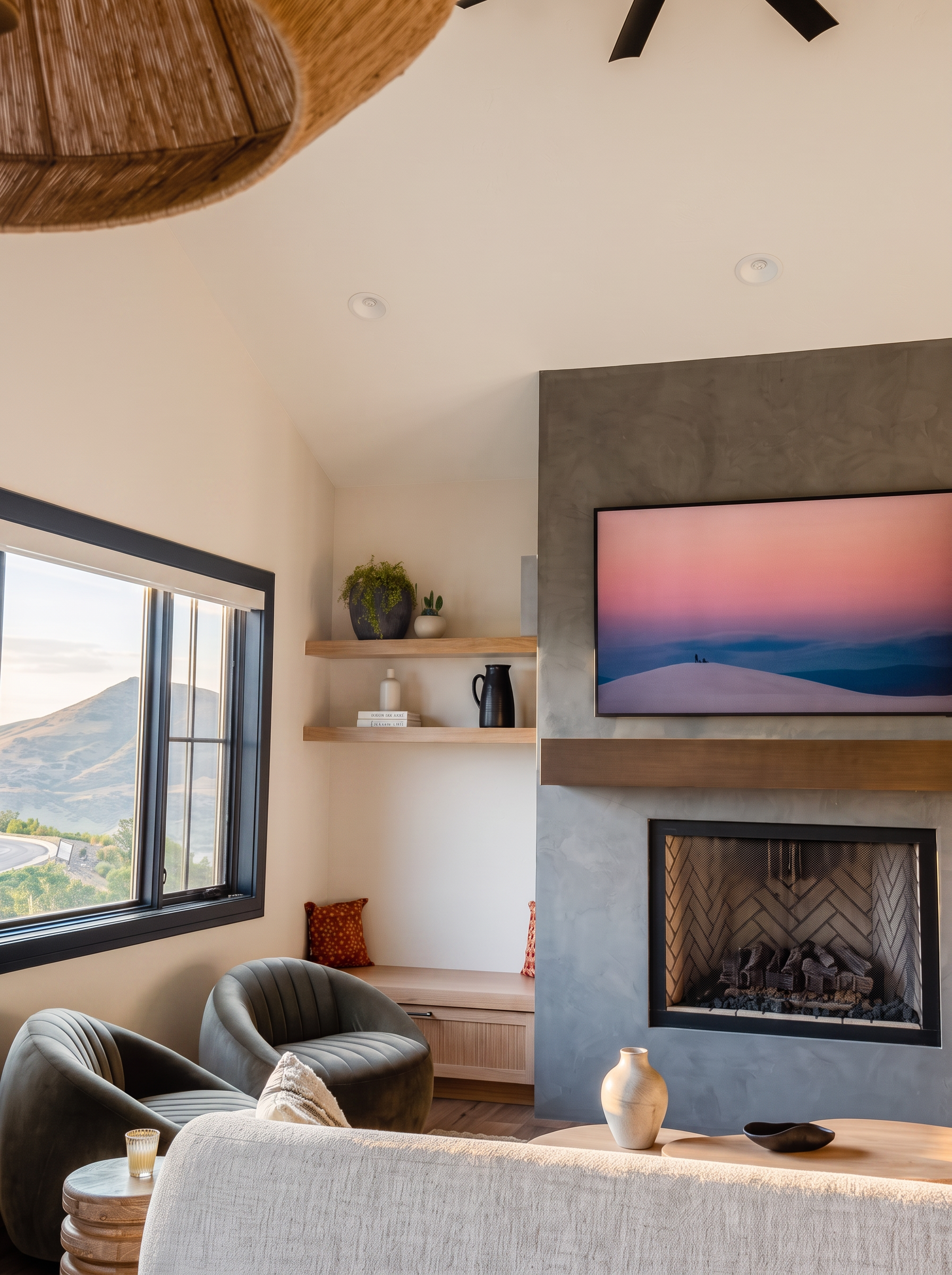 Great room seating and fireplace with window onto the Wasatch foothills